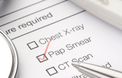 Doctors check list of tests required with a red tick next to Pap Smear