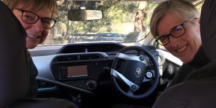 Dr Sue Mallett and Women's Health Tasmania CEO Jo Flanagan in the trusty Women's Health Tasmania work car/recording studio last year (such pre-social distancing proximity!)
